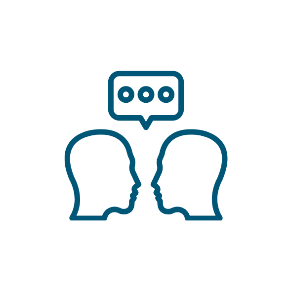 Icon of two facing head outlines with a speech bubble above, representing conversation.